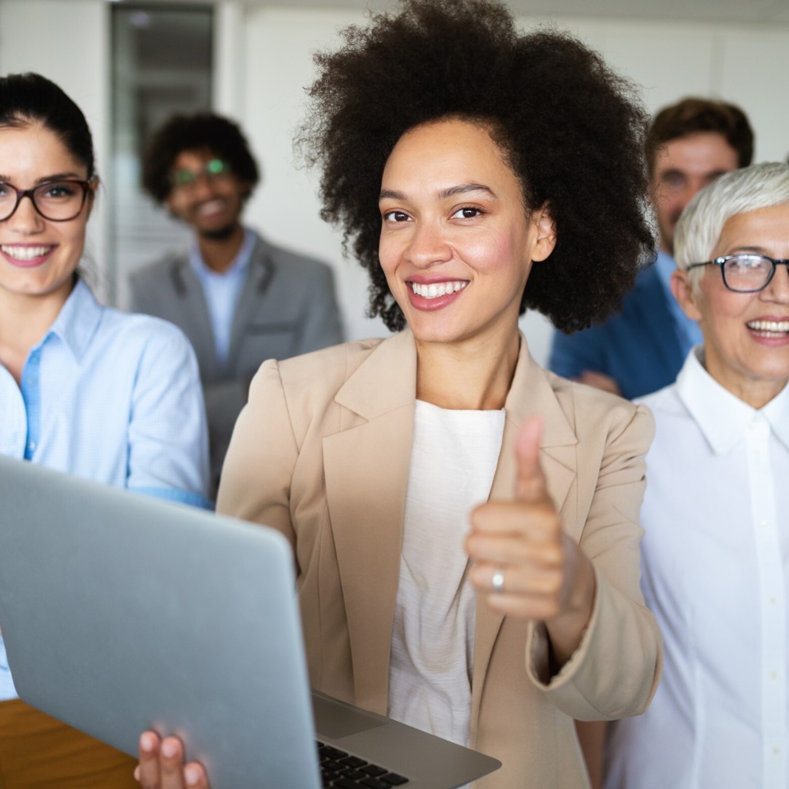 Empowerment program happy-business-people-celebrating-success-at-company square