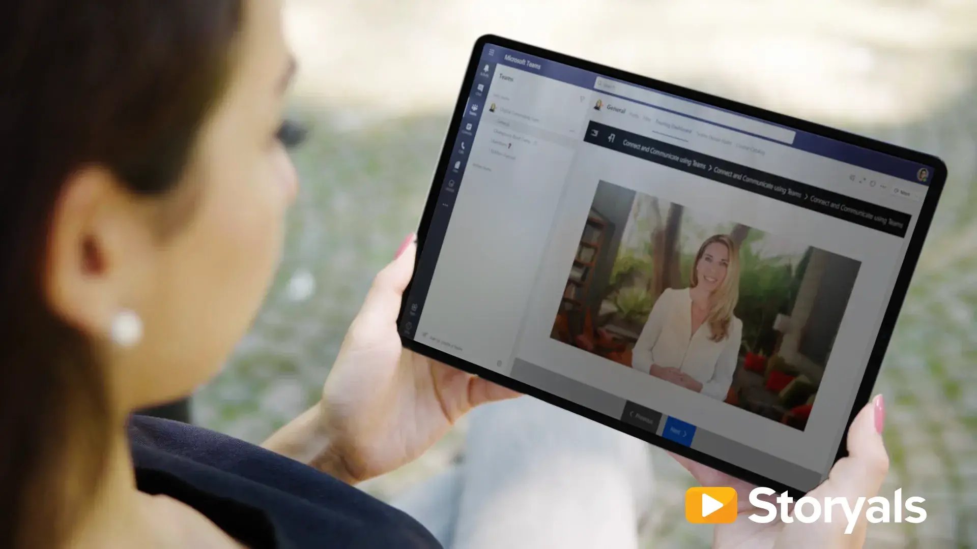 Woman watching Storyals Pro on tablet device